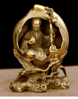 Brass God of longevity sitting in a peach  7 inch